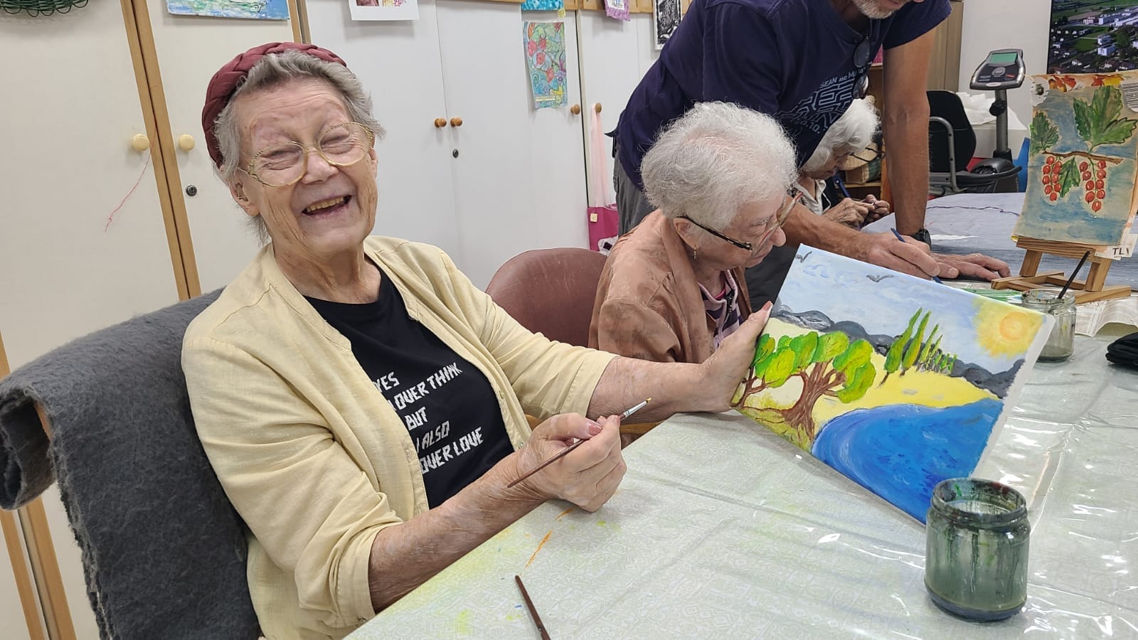 Nela showing her painting